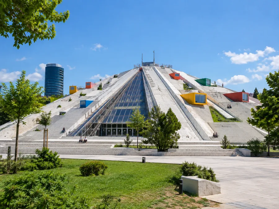 The renovated Pyramid of Tirana with white steps running up its sloping sides