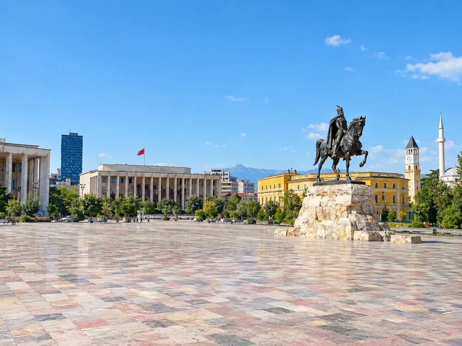 Skanderbeg Square in Tirana, a vast pale stone square with the equestrian statue of Skanderbeg